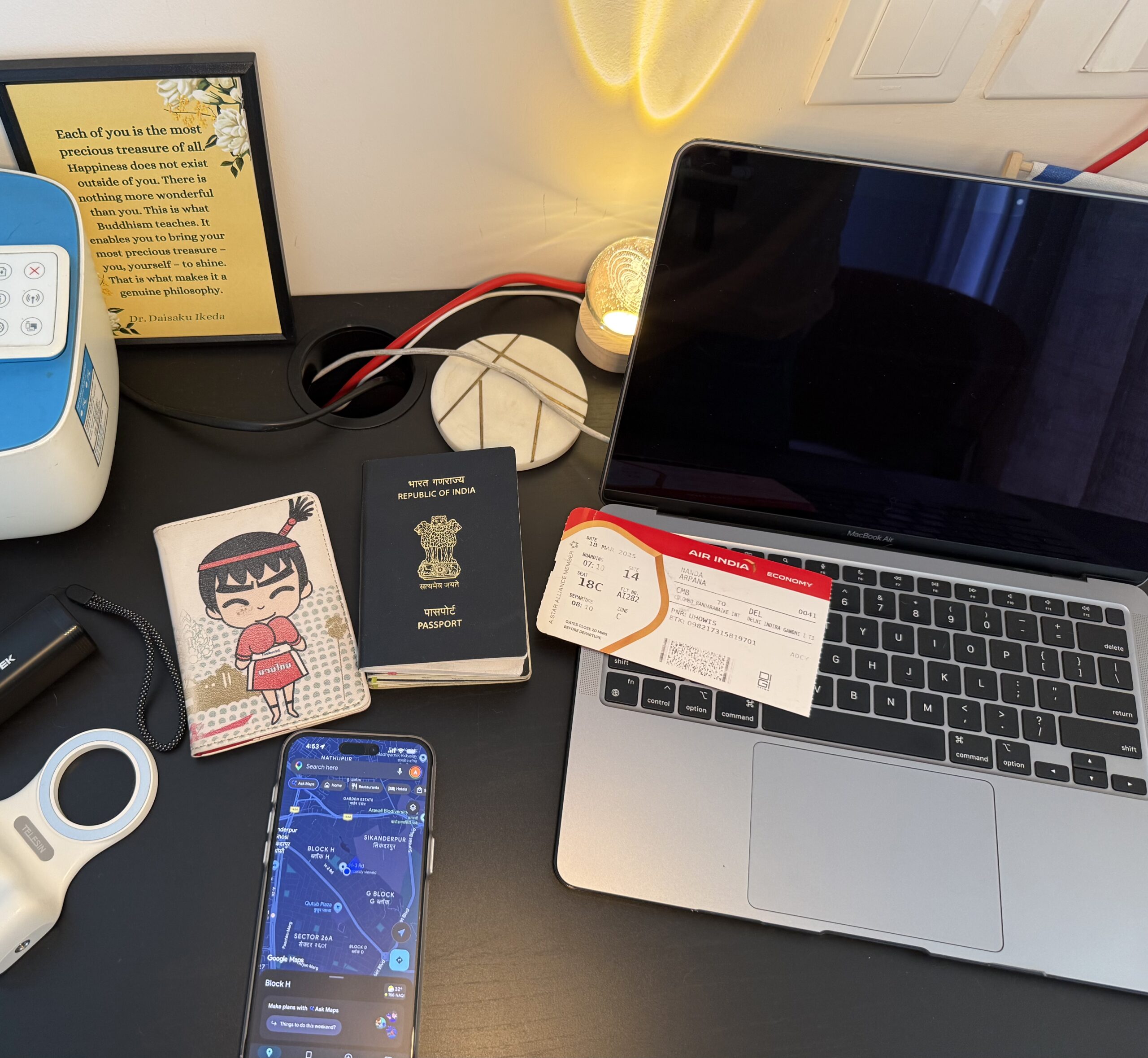 Phone showing Google Maps with passport and boarding pass for travel apps
